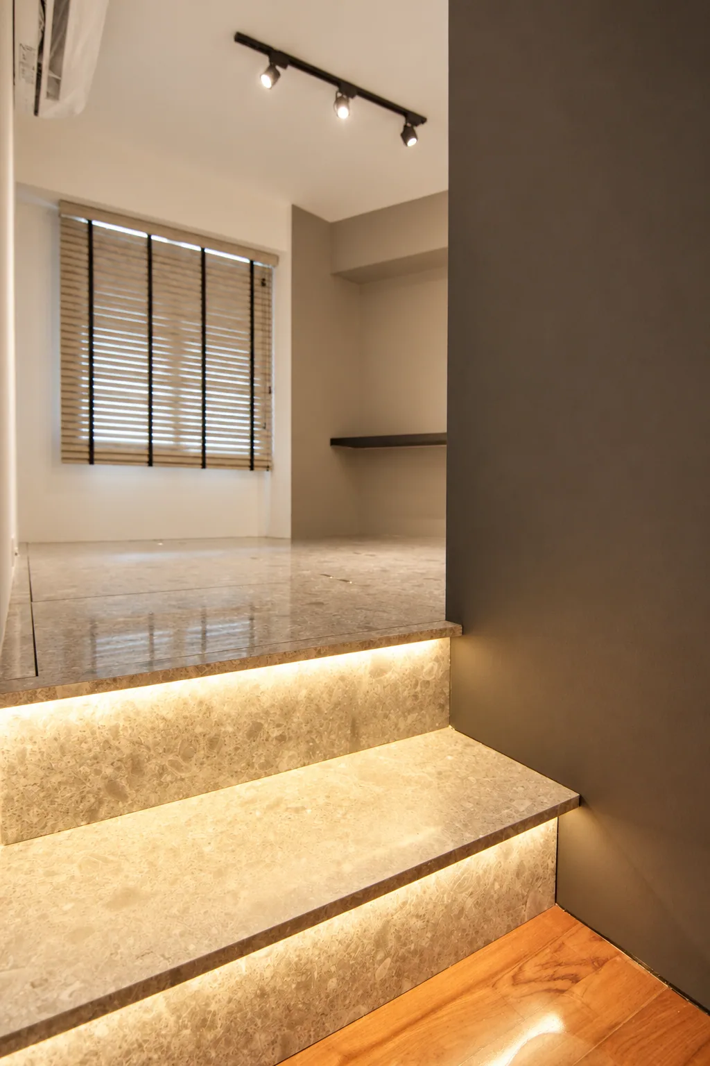 Punggol stone-look stepped detail with integrated warm lighting