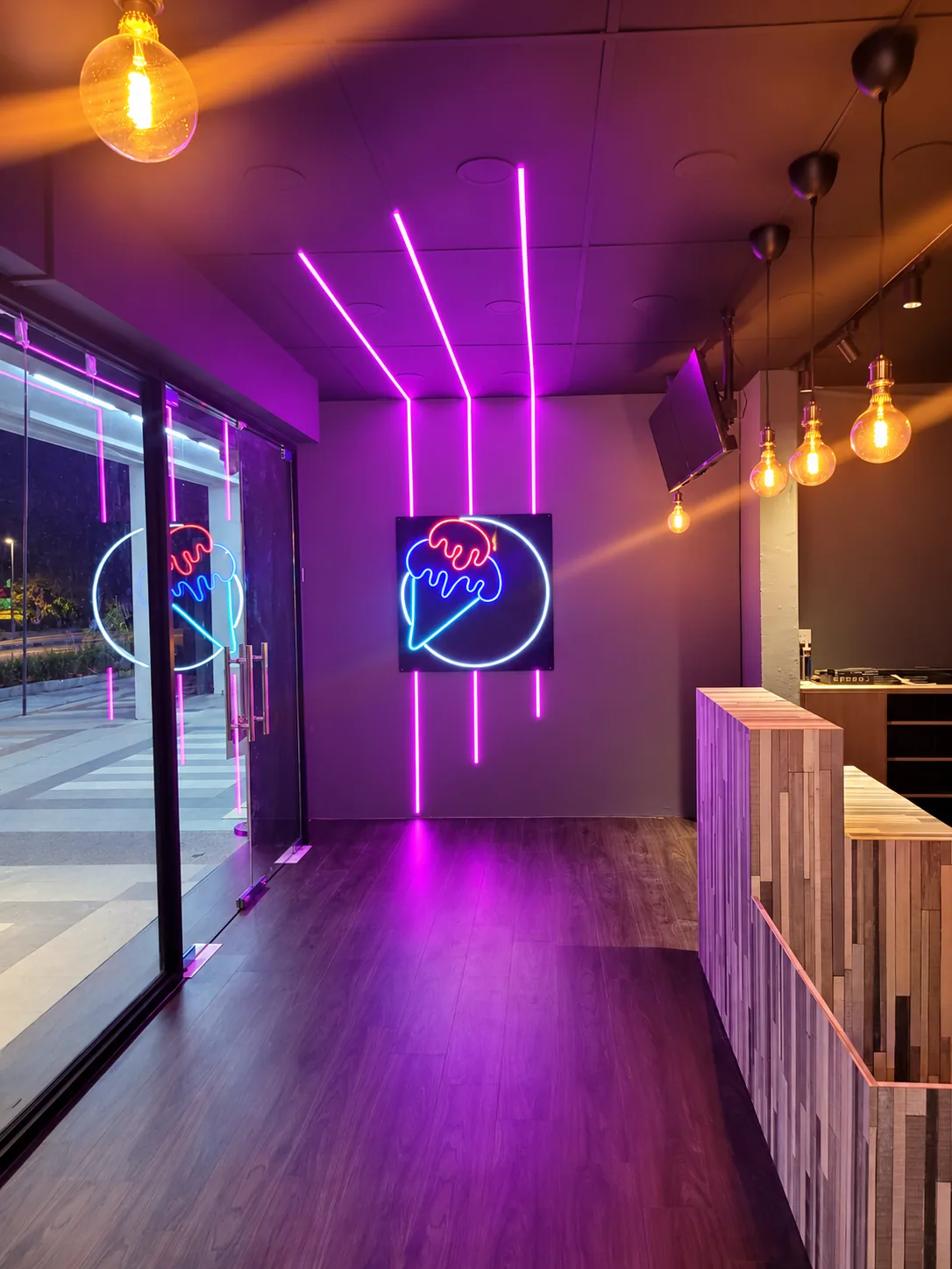 Privacy-edited Tampines ice cream shop with coloured lighting