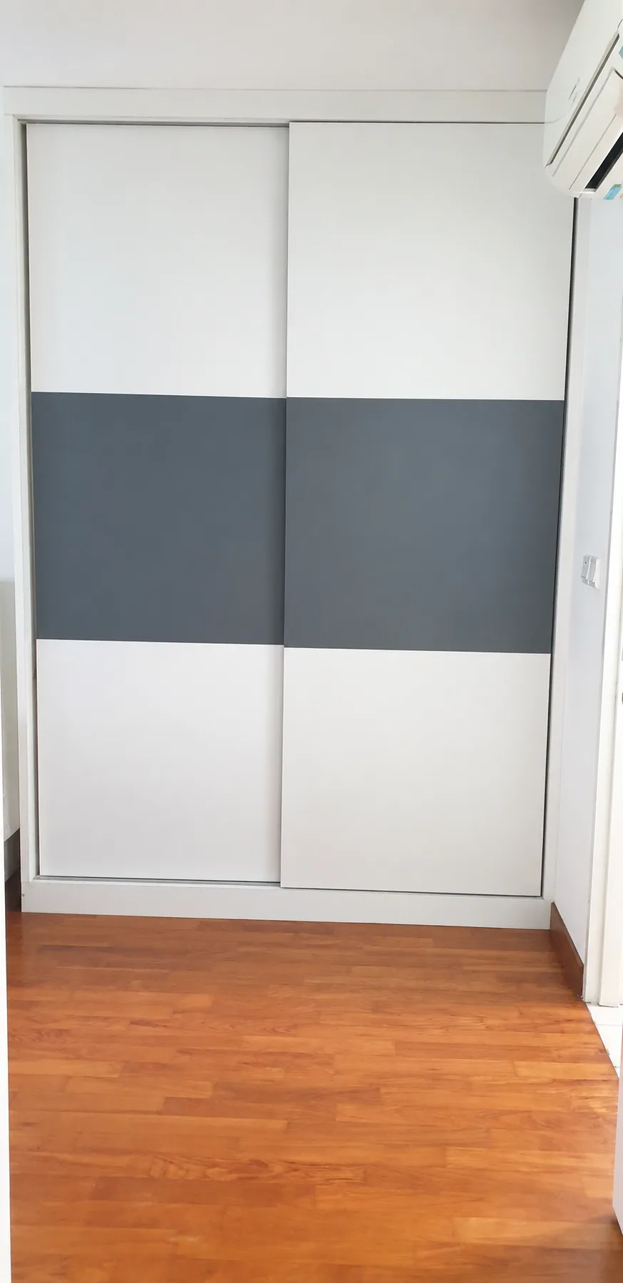 Yishun HDB two-tone white and grey sliding wardrobe